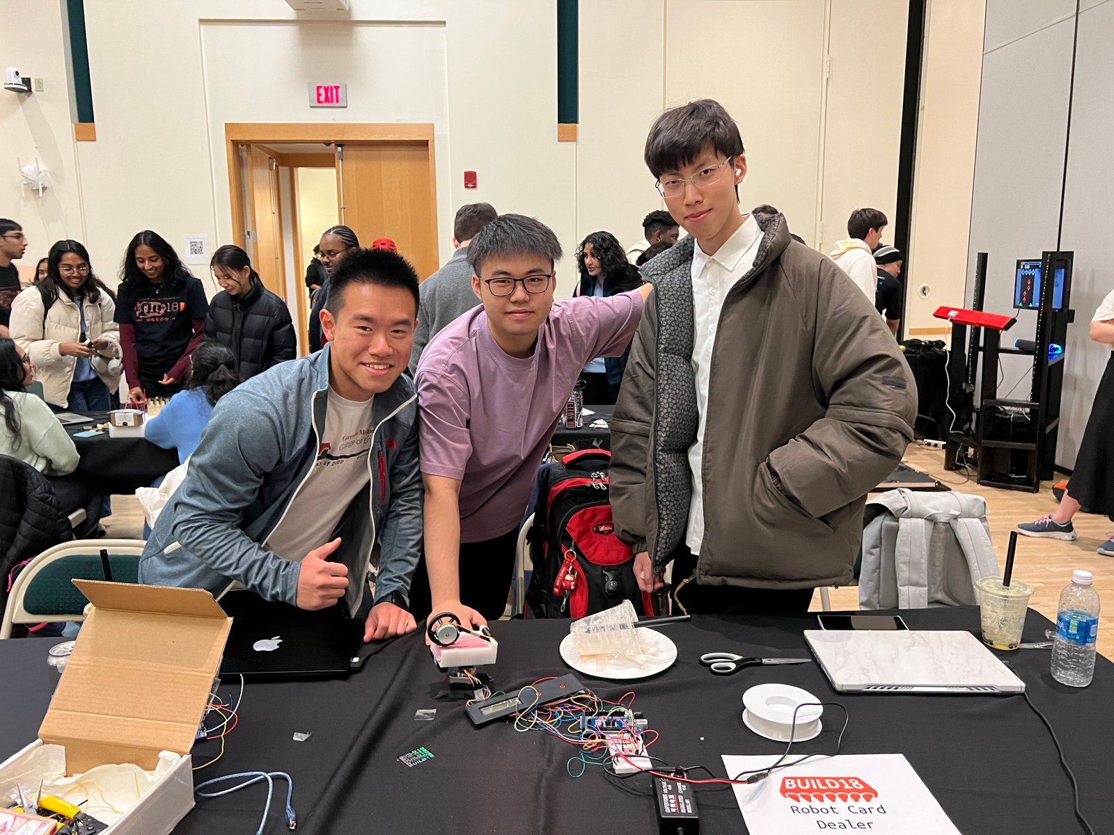 Robot card dealer team photo at Build18